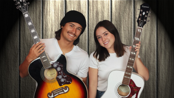 Bella & Rudy promo image, Rudy and Bella holding acoustic guitars