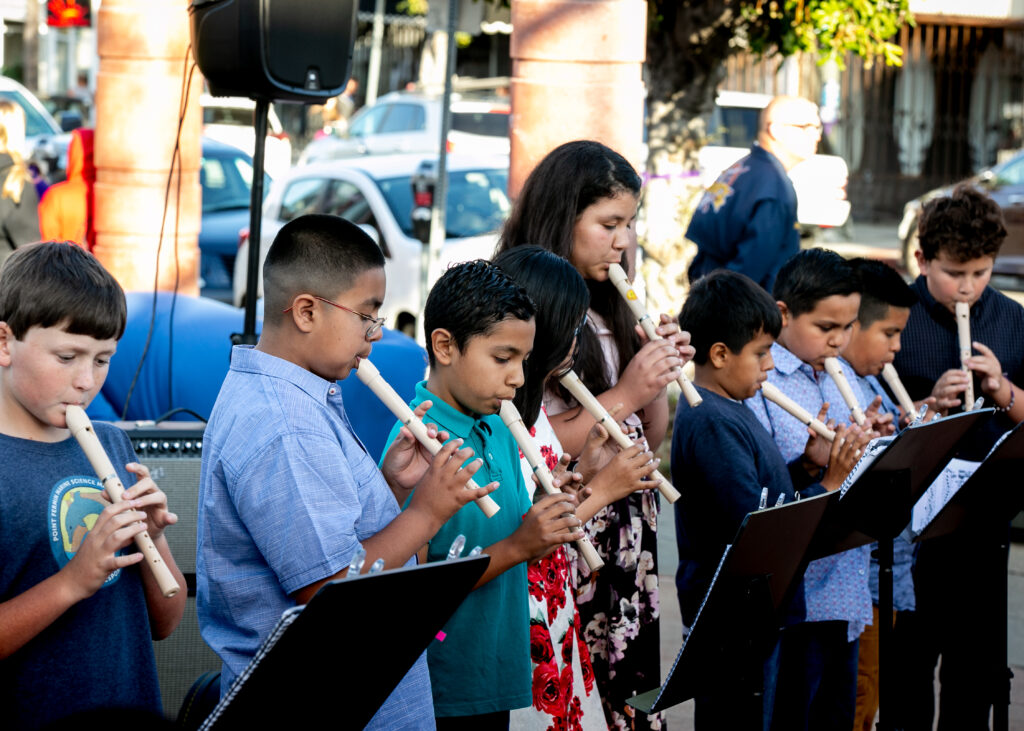 Recorders in Schools students perform on 6th street, 2019.