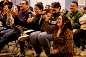 Teaching Artist Lupe proudly cheers on her Meet the Music Students, Photo by Taso Papadakis.