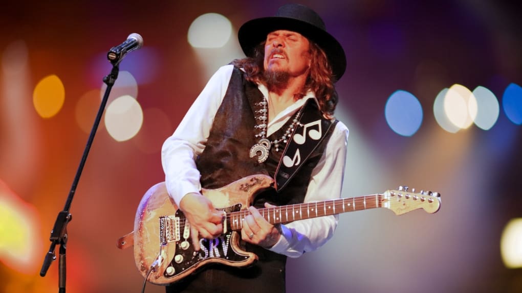 Roby Duron of Stevie Ray Visited playing guitar